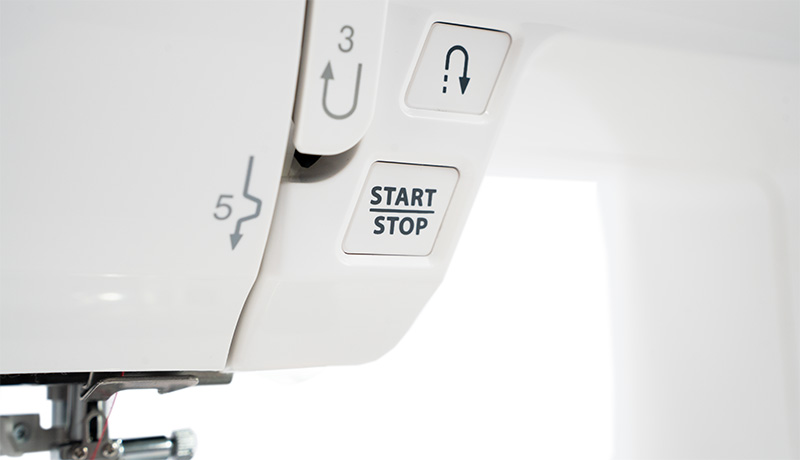 Janome DC6050 Start/stop button